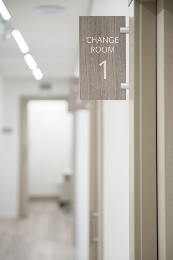 A sign on a door at the Alberta Reproductive Centre that reeds Change Room