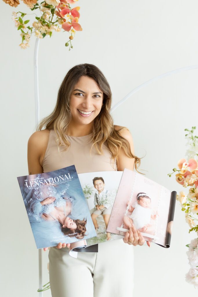 Edmonton Cake Smash Photographer Ana Salas holding magazines with her work featured